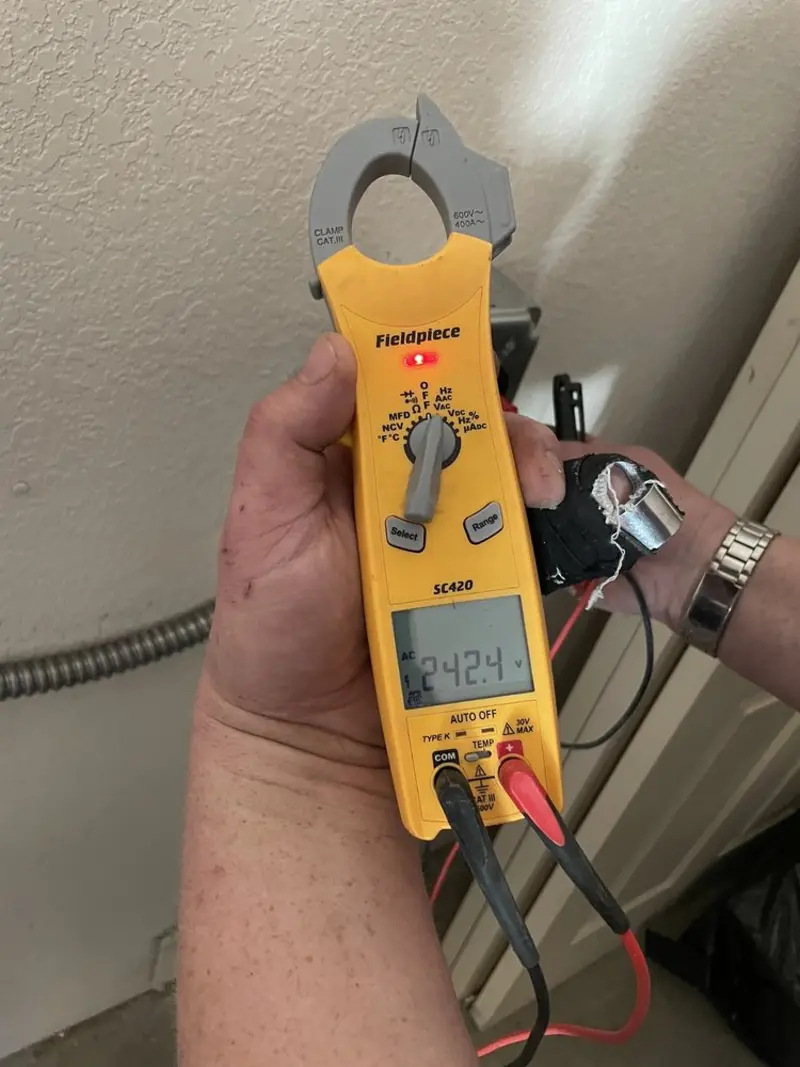 Voltage testing with clamp meter during Outlet Installation in La Vale
